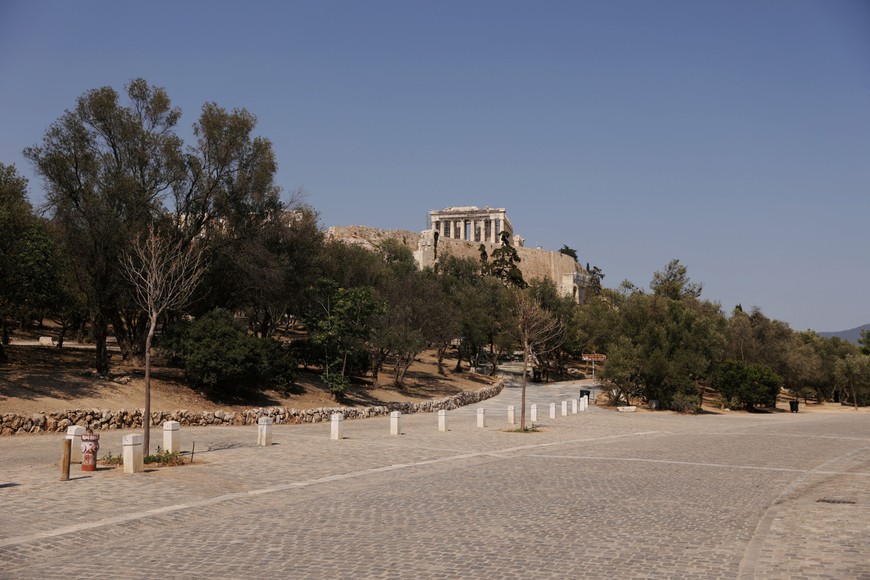A general view of empty Dionysiou Areopagitou Street with the Parthenon temple in the Acropolis hill archaeological site in the background, in Athens, Greece, July 21, 2023. REUTERS/Louiza Vradi