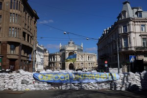 A Ukrainian flag waves on top of a barricade in front of the National Academic Theatre of Opera and Ballet, as Russia's invasion of Ukraine continues, in downtown Odessa, Ukraine, March 17, 2022. REUTERS/Nacho Doce