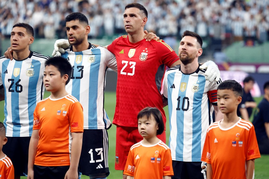 Soccer Football - Friendly - Argentina v Australia - Workers' Stadium, Beijing, China - June 15, 2023
Argentina's Lionel Messi, Emiliano Martinez, Cristian Romero and Nahuel Molina line up during the national anthems before the match REUTERS/Thomas Peter