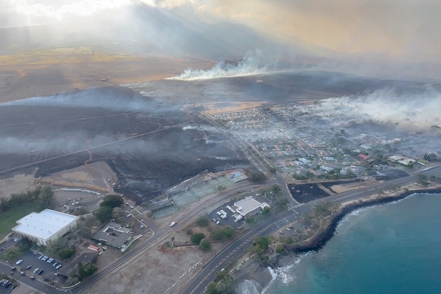 An aerial view as smoke rises from burnt areas amidst wildfires in Maui, Hawaii, U.S., August 9, 2023, in this screenshot taken from a social media video. Vince Carter/via REUTERS  THIS IMAGE HAS BEEN SUPPLIED BY A THIRD PARTY. MANDATORY CREDIT. NO RESALES. NO ARCHIVES.