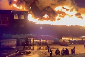 Firefighters work to douse a fire at a shopping mall destroyed during a Russian military strike, amid Russia's attack on Ukraine in Odesa, Ukraine in this screengrab from a video released August 14, 2023. State Emergency Service of Ukraine/Handout via REUTERS THIS IMAGE HAS BEEN SUPPLIED BY A THIRD PARTY. NO RESALES. NO ARCHIVES. MANDATORY CREDIT.