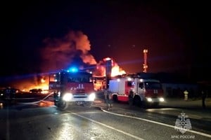 A view shows firefighting vehicles at the accident scene following an explosion at a gas station in the city of Makhachkala, Russia, August 14, 2023. Russian Emergencies Ministry in the Republic of Dagestan/Handout via REUTERS ATTENTION EDITORS - THIS IMAGE WAS PROVIDED BY A THIRD PARTY. NO RESALES. NO ARCHIVES. MANDATORY CREDIT. WATERMARK FROM SOURCE.