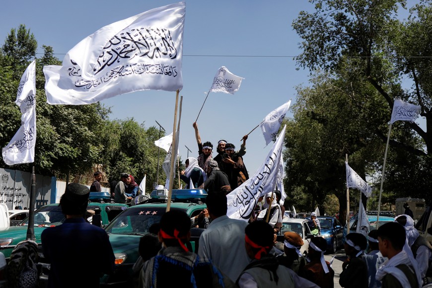 Taliban supporters celebrate on the second anniversary of the fall of Kabul on a street near the US embassy in Kabul, Afghanistan, August 15, 2023. REUTERS/Ali Khara