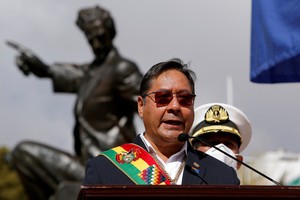 FILE PHOTO: Bolivian President Luis Arce, in front of a statue of national hero Eduardo Abaroa, speaks at a ceremony marking the landlocked country's claim to maritime access, lost to Chile after the War of the Pacific, in La Paz, Bolivia March 23, 2022. REUTERS/Manuel Claure/File Photo