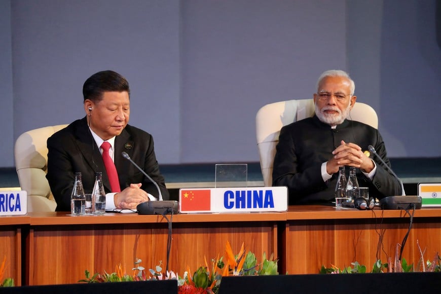 FILE PHOTO: Indian Prime Minister Narendra Modi and China's President Xi Jinping attend a BRICS summit meeting in Johannesburg, South Africa, July 27, 2018. REUTERS/Mike Hutchings/File Photo