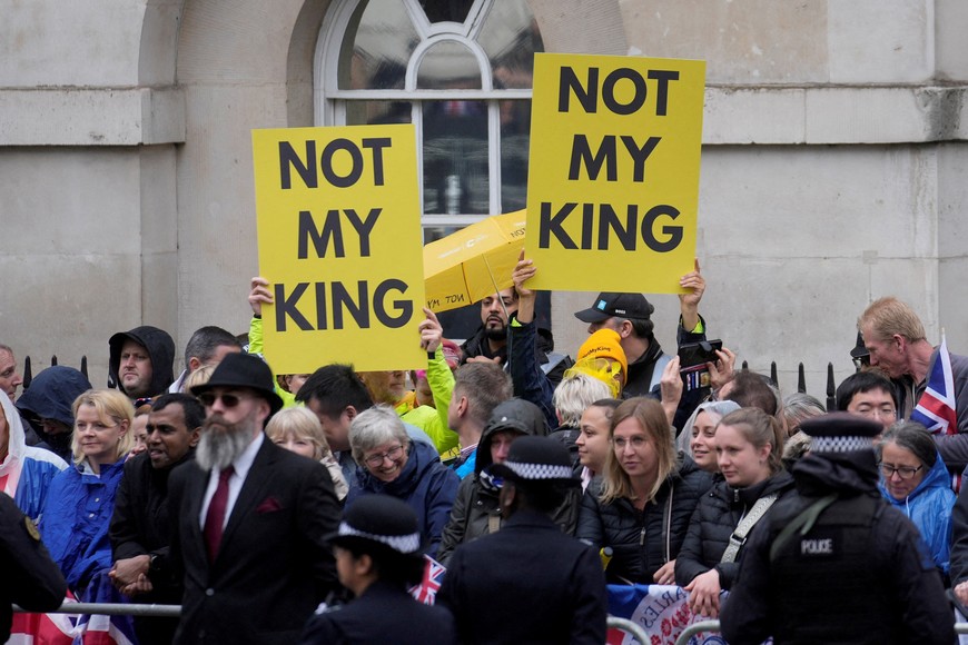 FILE PHOTO: Members of the anti-monarchist group Republic stage a protest along the route of the procession ahead of the coronation of King Charles III and Camilla, the Queen Consort, in London, Saturday, May 6, 2023.   Mosa'ab Elshamy/Pool via REUTERS/File Photo