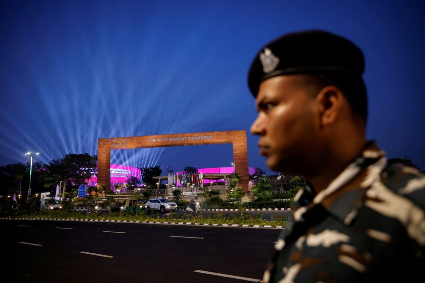 FILE PHOTO: A security personnel stands guard in front of 'Bharat Mandapam' the main venue of the G20 Summit in New Delhi, India, September 5, 2023. REUTERS/Adnan Abidi/File Photo