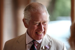 Britain's King Charles III laughs as he speaks with staff at the Poacher Cheese Farm during his visit to Lincolnshire on July 24, 2023 in Ulceby, Britain. Cameron Smith/Pool via REUTERS