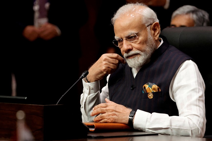 India's Prime Minister Narendra Modi listens as Indonesia's Prime Minister Joko Widodo (not pictured) delivers opening remarks during a plenary session of the ASEAN-India Summit in Jakarta, Indonesia, September 7, 2023. REUTERS/Willy Kurniawan/Pool REFILE - CORRECTING TITLE FROM "PRESIDENT" TO "PRIME MINISTER"