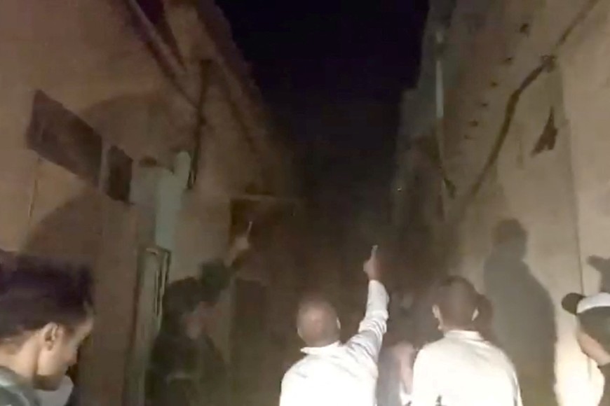 People look at the damage caused by an earthquake in Marrakech, Morocco September 9, 2023 in this screen grab from a social media video in this picture. Al Maghribi Al Youm/via REUTERS  THIS IMAGE HAS BEEN SUPPLIED BY A THIRD PARTY. MANDATORY CREDIT. NO RESALES. NO ARCHIVES.