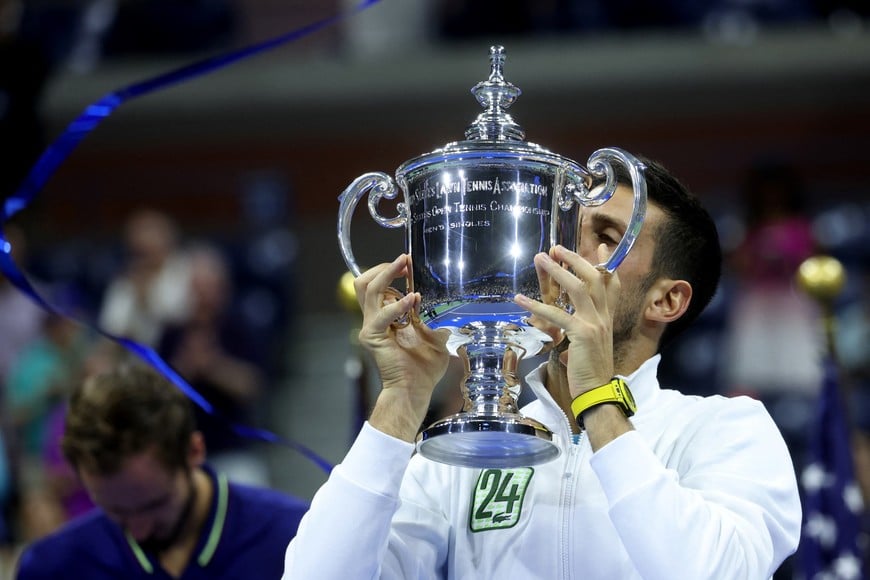 Tennis - U.S. Open - Flushing Meadows, New York, United States - September 10, 2023
Serbia's Novak Djokovic celebrates with the trophy after winning the U.S. Open against Russia's Daniil Medvedev REUTERS/Mike Segar