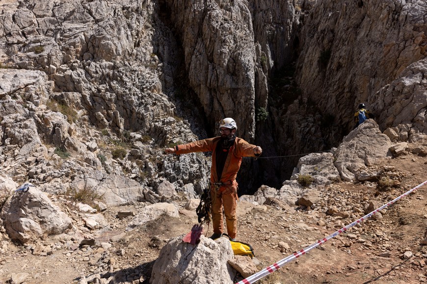 A rescuer stands at the entrance of Morca Cave as they take part in a rescue operation to reach U.S. caver Mark Dickey who fell ill and became trapped some 1,000 meters (3,280 ft) underground, near Anamur in Mersin province, southern Turkey