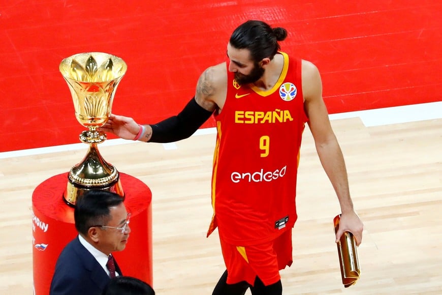 Basketball - FIBA World Cup - Final - Argentina v Spain - Wukesong Sport Arena, Beijing, China - September 15, 2019  Spain's Ricky Rubio next to the FIBA World Cup trophy  REUTERS/Thomas Peter