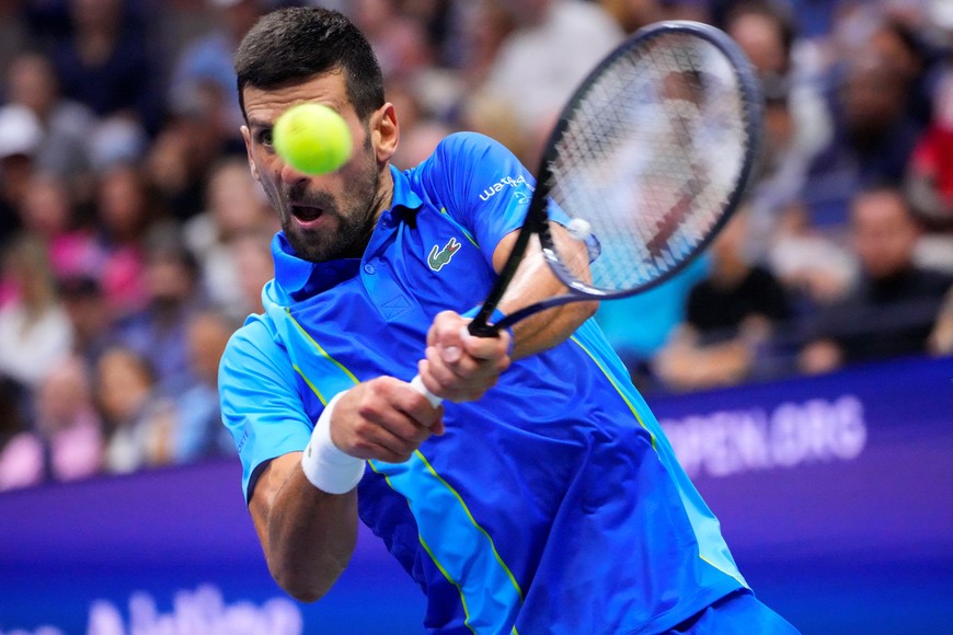 Sep 10, 2023; Flushing, NY, USA; Novak Djokovic of Serbia hits a backhand against Daniil Medvedev (not pictured) in the men's singles final on day fourteen of the 2023 U.S. Open tennis tournament at USTA Billie Jean King National Tennis Center. Mandatory Credit: Robert Deutsch-USA TODAY Sports