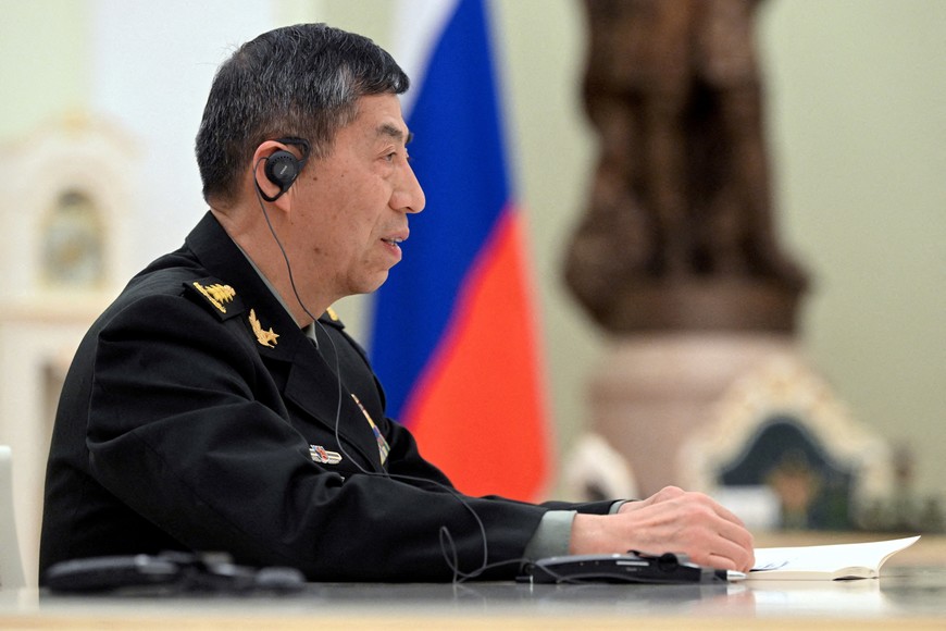 FILE PHOTO: Chinese Defence Minister Li Shangfu attends a meeting with Russian President Vladimir Putin and Defence Minister Sergei Shoigu in Moscow, Russia, April 16, 2023. Sputnik/Pavel Bednyakov/Pool via REUTERS/File Photo ATTENTION EDITORS - THIS IMAGE WAS PROVIDED BY A THIRD PARTY.