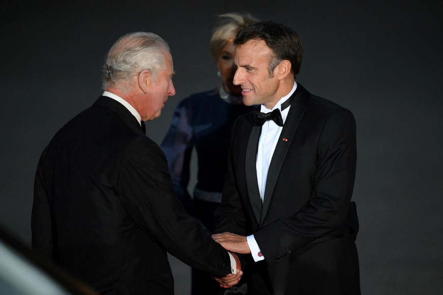 Britain's King Charles shakes hands with French President Emmanuel Macron as they arrive to attend a state banquet at the Palace of Versailles, west of Paris, on September 20, 2023, on the first day of a British royal state visit to France. Britain's King Charles and his wife Queen Camilla are on a three-day state visit to France. DANIEL LEAL/Pool via REUTERS