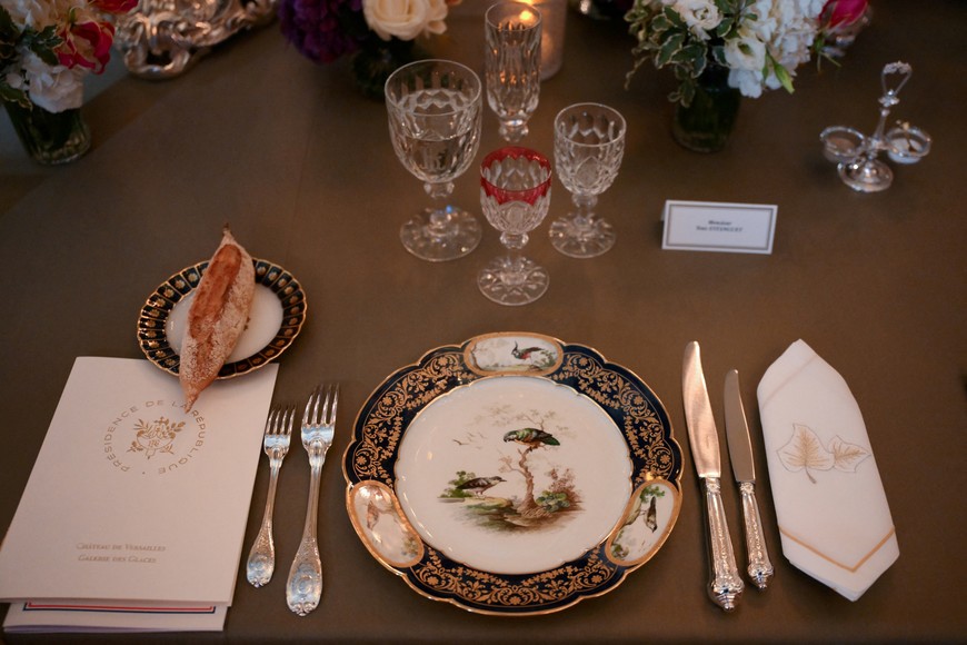 A photo shows a dinner set ahead of a state banquet at the Palace of Versailles, west of Paris, on September 20, 2023, on the first day of a British royal state visit to France. Britain's King Charles and his wife Queen Camilla are on a three-day state visit to France. DANIEL LEAL/Pool via REUTERS