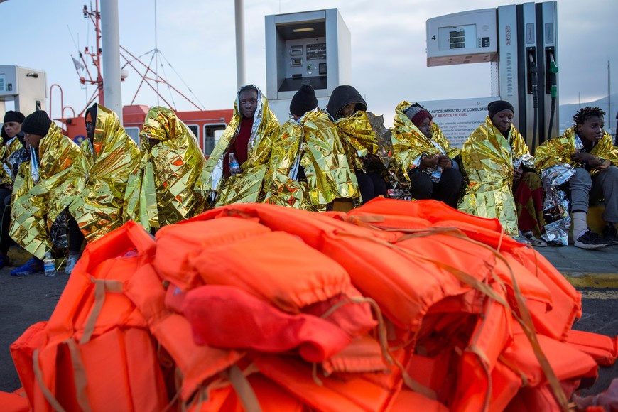 Migrants rest after being rescued by the Spanish Coast Guard on the Chafarinas Islands in the Mediterranean Sea, and later taken by boat to the Spanish North African enclave of Melilla, December 28, 2019. REUTERS/Jesus Blasco de Avellaneda