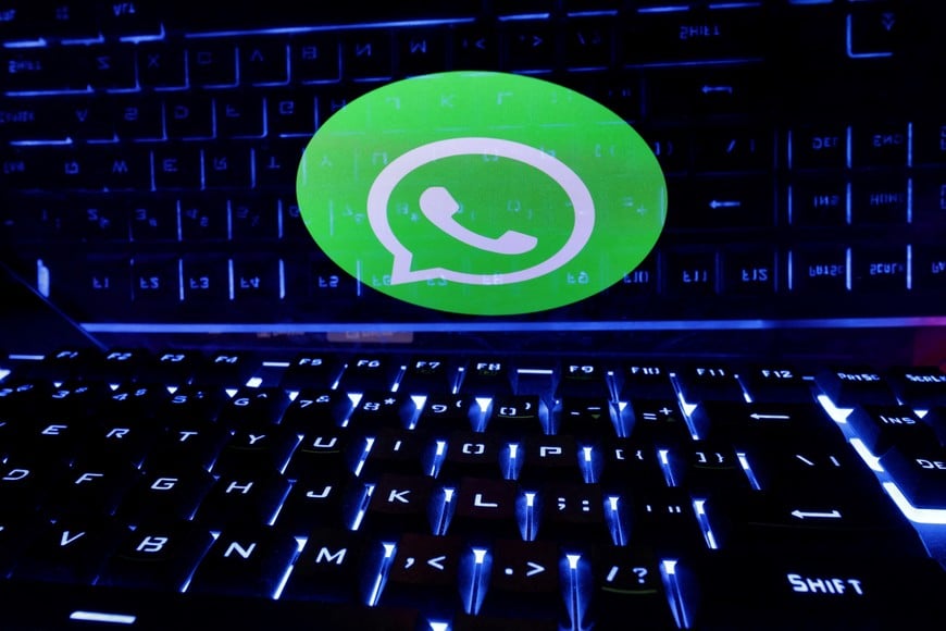 FILE PHOTO: A keyboard is placed in front of a displayed WhatsApp logo in this illustration taken February 21, 2023. REUTERS/Dado Ruvic/Illustration/File Photo