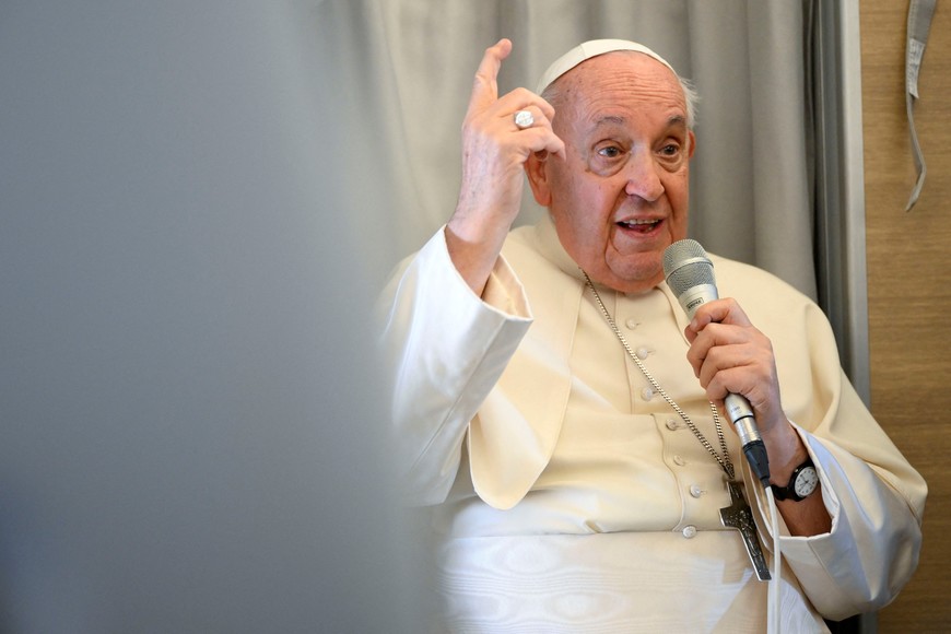 Pope Francis speaks during a press conference aboard the papal plane on his flight back after visiting Mongolia, September 4, 2023. Vatican Media/­Handout via REUTERS    ATTENTION EDITORS - THIS IMAGE WAS PROVIDED BY A THIRD PARTY.