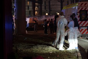 Italian scientific police members work at the scene of a crashed bus, in the city of Mestre near Venice, Italy, October 4, 2023. REUTERS/Manuel Silvestri