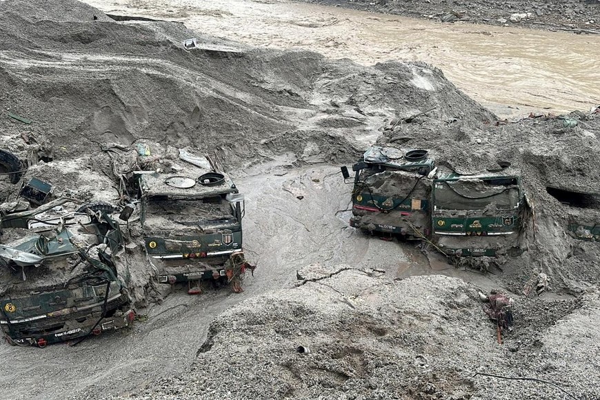 Trucks buried in mud are seen in an area affected by flood in Sikkim in this undated handout image released by the Indian Army on October 5, 2023. India Army/Handout via REUTERS THIS IMAGE HAS BEEN SUPPLIED BY A THIRD PARTY. NO RESALES. NO ARCHIVES.     TPX IMAGES OF THE DAY