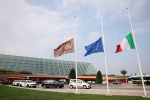 Flags are seen at half mast outside Dell'Angelo hospital, where some injured people were taken after a coach crashed off an overpass in Mestre, near Venice, Italy, October 4, 2023. REUTERS/Claudia Greco