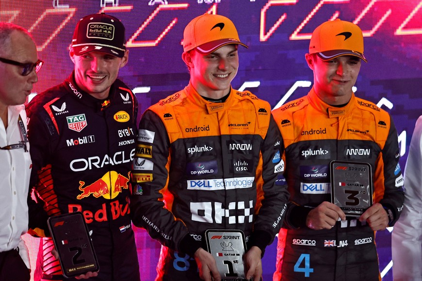 Formula One F1 - Qatar Grand Prix - Lusail International Circuit, Lusail, Qatar - October 7, 2023
McLaren's Oscar Piastri celebrates after winning the sprint race alongside second place Red Bull's Max Verstappen and third place McLaren's Lando Norris REUTERS/Hamad I Mohammed