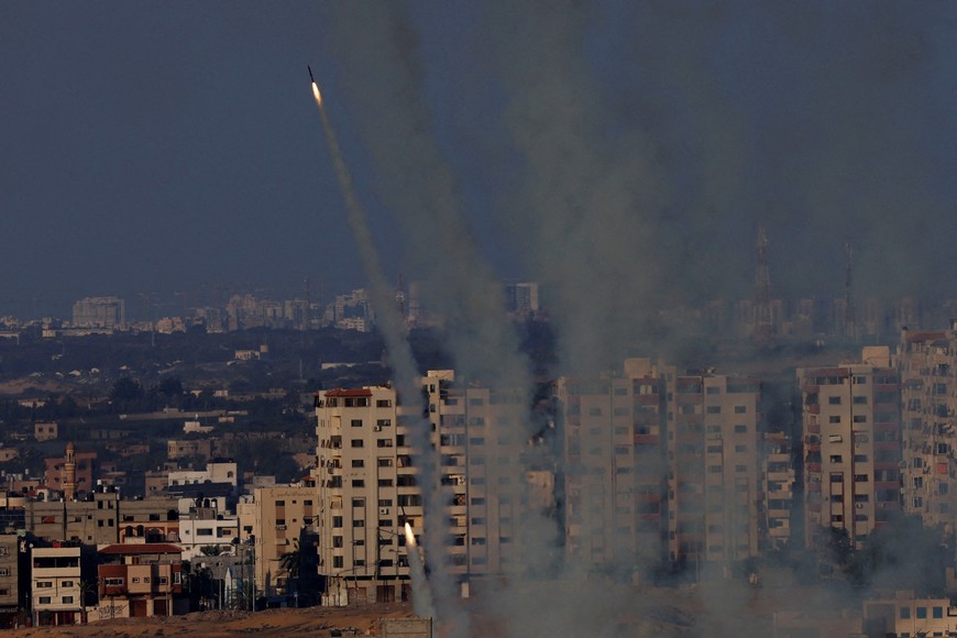 FILE PHOTO: Rockets are fired from Gaza towards Israel, in Gaza, October 10, 2023. REUTERS/Mohammed Salem/File Photo