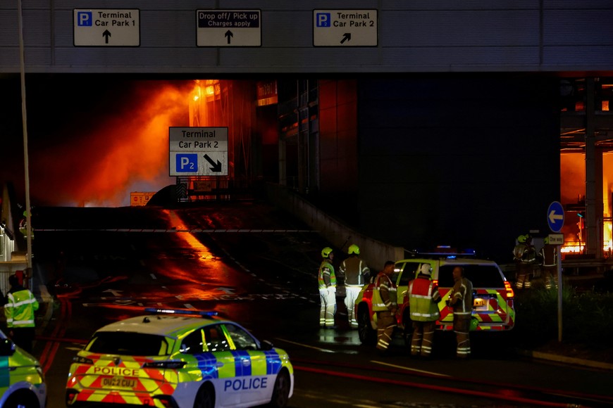 Emergency services respond to a fire in Terminal Car Park 2 at London Luton airport in Luton, Britain, October 11, 2023.  REUTERS/Peter Cziborra