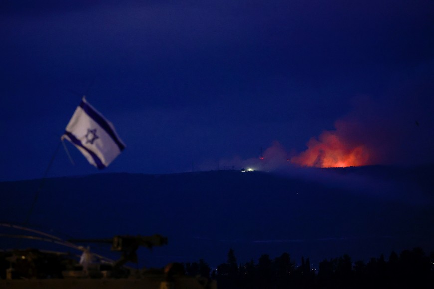 Flame and smoke rise over Lebanon as seen from Israel's border with Lebanon, in northern Israel, October 10, 2023. REUTERS/Ammar Awad     TPX IMAGES OF THE DAY