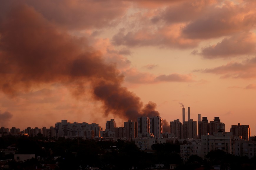 Smoke is seen behind Ashkelon near Israel's border with the Gaza Strip, in southern Israel, October 13, 2023. REUTERS/Amir Cohen