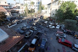 A view shows an area of Al-Ahli hospital where hundreds of Palestinians were killed in a blast that Israeli and Palestinian officials blamed on each other, and where Palestinians who fled their homes were sheltering amid the ongoing conflict with Israel,  in Gaza City, October 18, 2023.  REUTERS/Mohammed Al-Masri     TPX IMAGES OF THE DAY
