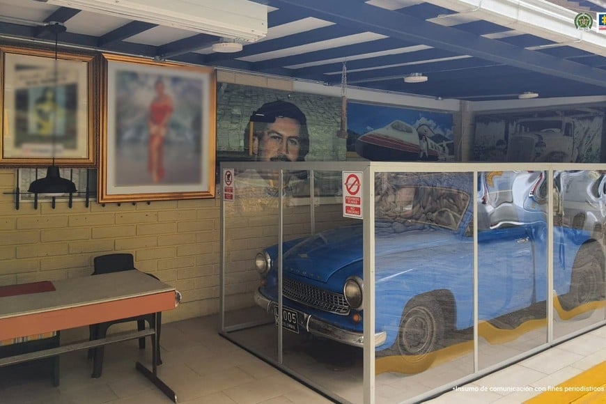 Framed pictures and a car of late drug kingpin Pablo Escobar are seen at a property seized by the Colombian Prosecutor's office, in Medellin, Colombia, in this handout distributed to Reuters on October 20, 2023. Colombian Prosecutor's Office/Handout via REUTERS THIS IMAGE HAS BEEN SUPPLIED BY A THIRD PARTY. NO RESALES. NO ARCHIVES. WATERMARK FROM SOURCE. IMAGE BLURRED AT SOURCE