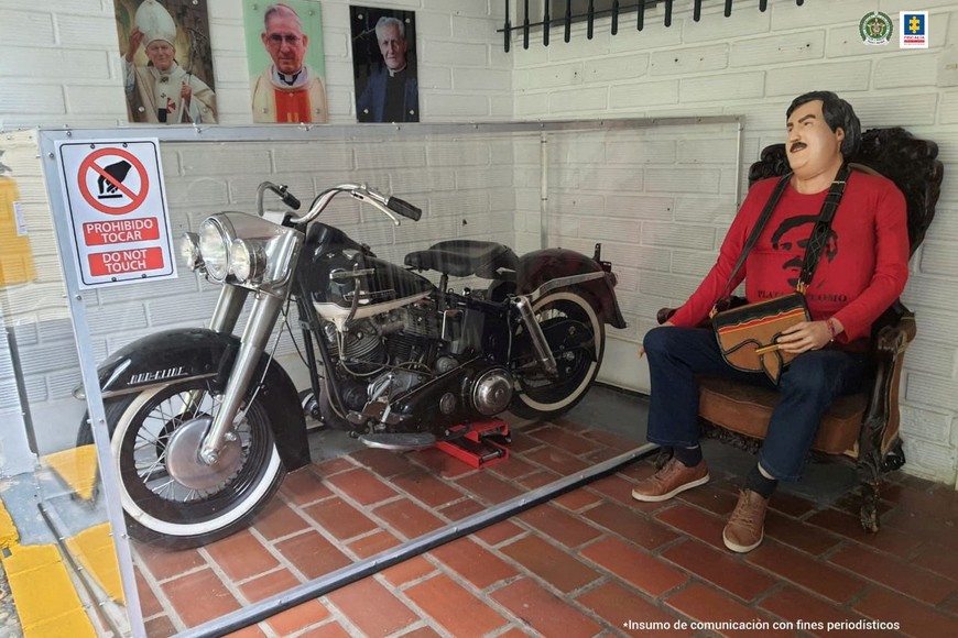 A mannequin of late drug kingpin Pablo Escobar is seen next to a motorcycle at a property seized by the Colombian Prosecutor's office, in Medellin, Colombia, in this handout distributed to Reuters on October 20, 2023. Colombian Prosecutor's Office/Handout via REUTERS THIS IMAGE HAS BEEN SUPPLIED BY A THIRD PARTY. NO RESALES. NO ARCHIVES. WATERMARK FROM SOURCE