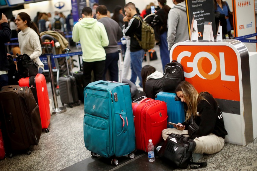 Passangers wait at the Aeroparque Jorge Newbery airport as flights were cancelled due a porters' strike, in Buenos Aires, Argentina August 15, 2023. REUTERS/Agustin Marcarian