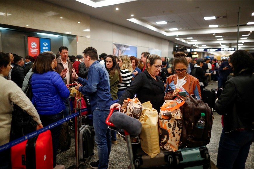 Passengers wait at the Aeroparque Jorge Newbery airport as flights were cancelled due a porters' strike, in Buenos Aires, Argentina August 15, 2023. REUTERS/Agustin Marcarian