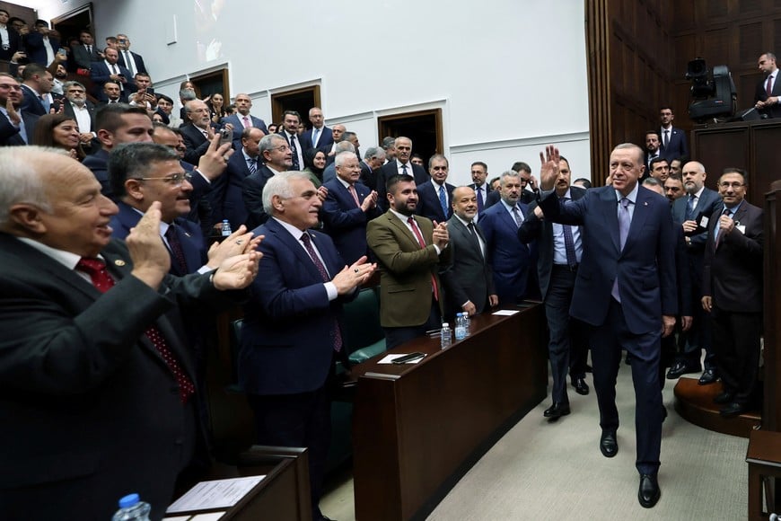 Turkish President Tayyip Erdogan walks as he attends a meeting with members of parliament from his ruling AK Party (AKP) at the Turkish parliament in Ankara, Turkey, October 25, 2023. Murat Cetinmuhurdar/PPO/Handout via REUTERS THIS IMAGE HAS BEEN SUPPLIED BY A THIRD PARTY. NO RESALES. NO ARCHIVES