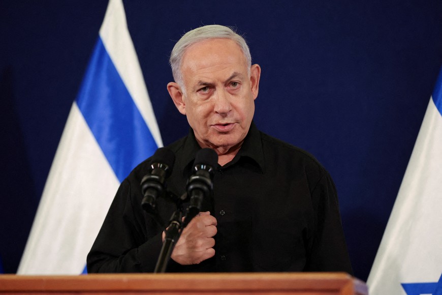 Israeli Prime Minister Benjamin Netanyahu holds a press conference with Defense Minister Yoav Gallant and Cabinet Minister Benny Gantz (not pictured) in the Kirya military base in Tel Aviv , Israel , 28 October  2023.    ABIR SULTAN POOL/Pool via REUTERS