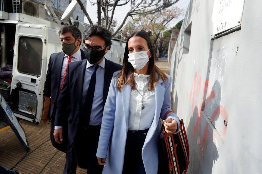 Agustina Cosachov, psychiatrist of late Argentine soccer legend Diego Armando Maradona arrives to a prosecutor's office in San Isidro, accompanied by her lawyer, Vadim Mischanchuk, in Buenos Aires, Argentina June 25, 2021. REUTERS/Agustin Marcarian