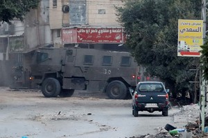 An Israeli army vehicle operates during an Israeli raid in Jenin, in the Israeli-occupied West Bank, November 9, 2023. REUTERS/Raneen Sawafta