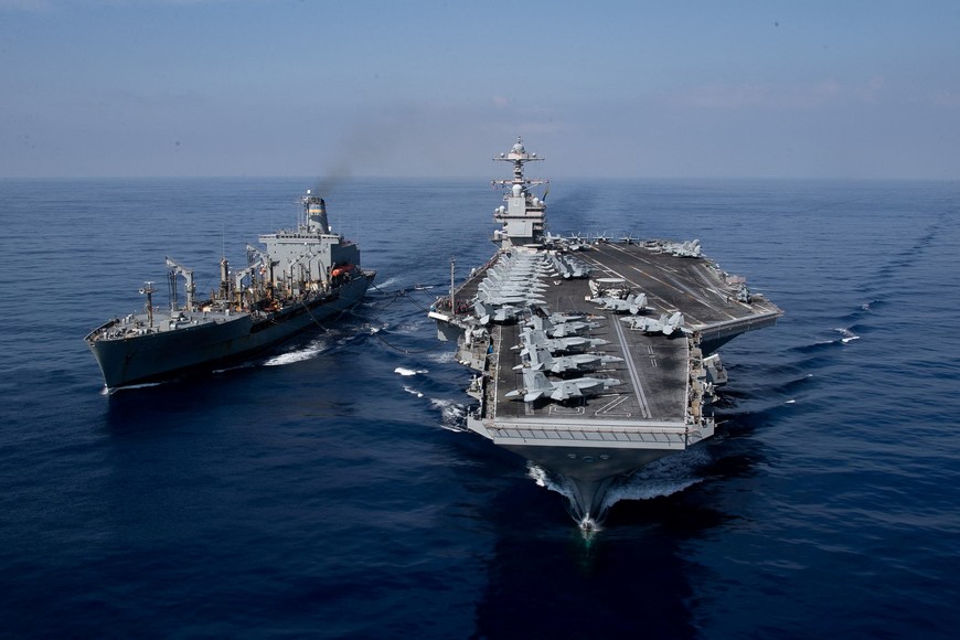 The world’s largest aircraft carrier USS Gerald R. Ford steams alongside USNS Laramie (T-AO-203) during a fueling-at-sea in the eastern Mediterranean Sea, as a scheduled deployment in the U.S Naval Forces Europe area of operations, deployed by U.S. Sixth Fleet to defend U.S, allied, and partners interests, in this photo taken on October, 11, 2023 and released by U.S. Navy on October 14, 2023. U.S Naval Forces Central Command / U.S. 6th Fleet / Handout via REUTERS ATTENTION EDITORS - THIS PICTURE WAS PROVIDED BY A THIRD PARTY