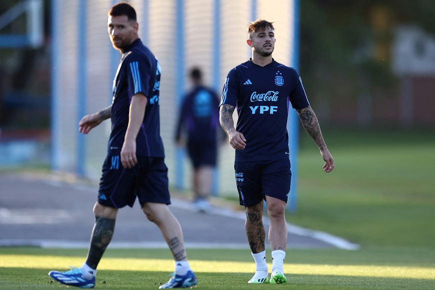 Soccer Football - World Cup - South American Qualifiers - Argentina Training - Lionel Andres Messi Training Ground, Buenos Aires, Argentina - November 14, 2023 
Argentina's Pablo Maffeo and Lionel Messi during training REUTERS/Agustin Marcarian