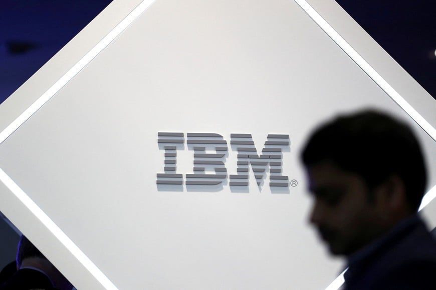 FILE PHOTO: A man stands near an IBM logo at the Mobile World Congress in Barcelona, Spain, February 25, 2019.  REUTERS/Sergio Perez/File Photo