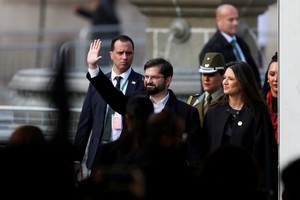 Chile's President Gabriel Boric and first lady Irina Karamanos arrive for an official ceremony marking the 50 anniversary of the coup that toppled Salvador Allende and started Augusto Pinochet's dictatorship, at La Moneda government palace, in Santiago, Chile, September 11, 2023. REUTERS/Ivan Alvarado