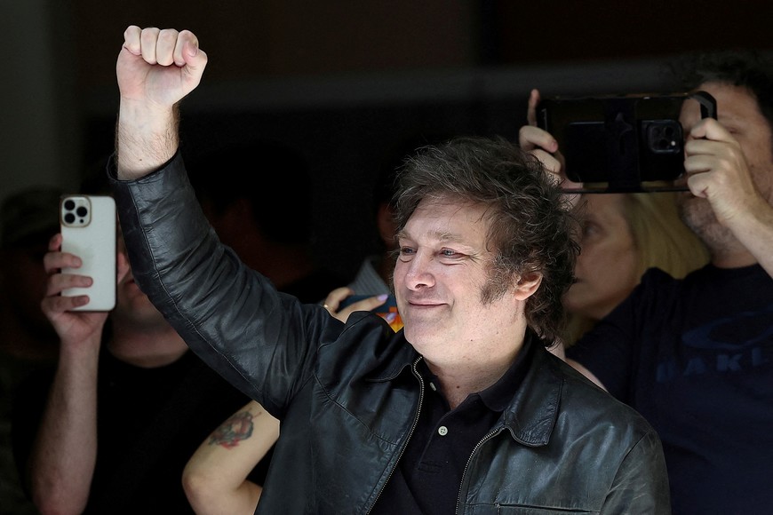 Argentine presidential candidate Javier Milei gestures, as he visits a polling station to cast his vote, during Argentina's runoff presidential election, in Buenos Aires, Argentina November 19, 2023. REUTERS/Agustin Marcarian
     TPX IMAGES OF THE DAY