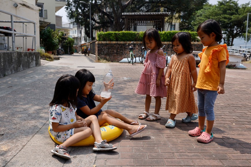 Children play at a playgroup class, on Peng Chau island, in Hong Kong, China September 19, 2022. Newcomers drawn by an idyllic lifestyle and low rents in one of the world's priciest property markets are rejuvenating Peng Chau, reversing an exodus in the 1970s as fortunes waned in the area, once home to Hong Kong's biggest matchstick factory.      REUTERS/Tyrone Siu    SEARCH "PENG CHAU SIU" FOR THIS STORY. SEARCH "WIDER IMAGE" FOR ALL STORIES.