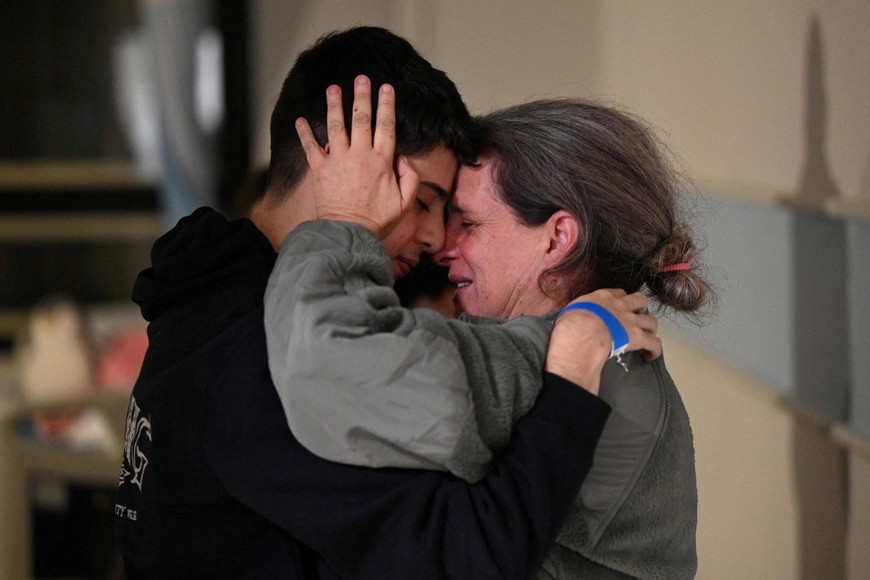 Sharon Avigdori, who was abducted by Hamas gunmen during the October 7 attack on Israel, hugs her son Omer shortly after being released on November 25, at an unknown location, in this handout picture released on November 26, 2023. Israeli Government Press Office/Haim Zach/Handout via REUTERS THIS IMAGE HAS BEEN SUPPLIED BY A THIRD PARTY. MANDATORY CREDIT