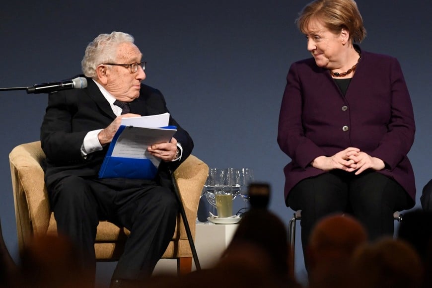 FILE PHOTO: German Chancellor Angela Merkel and former U.S. Secretary of State Henry A. Kissinger attend the American Academy's award ceremony at Charlottenburg Palace in Berlin, Germany, January 21, 2020.  REUTERS/Annegret Hilse/File Photo
