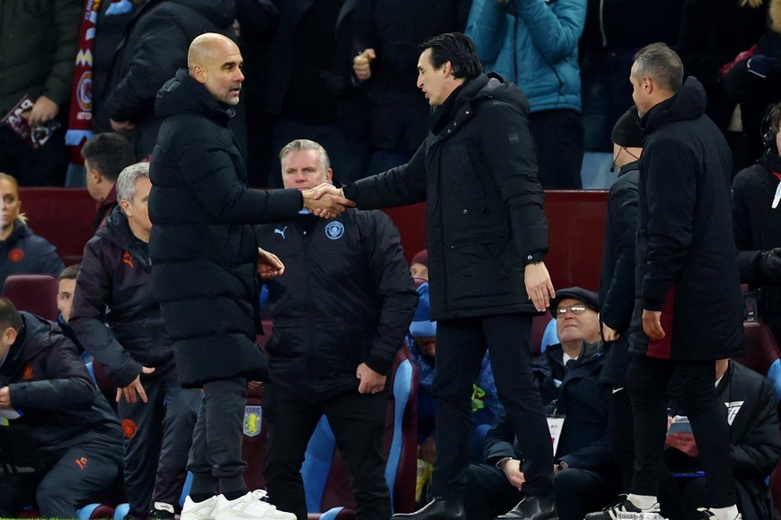 Soccer Football - Premier League - Aston Villa v Manchester City - Villa Park, Birmingham, Britain - December 6, 2023 
Manchester City manager Pep Guardiola shakes hands with Aston Villa manager Unai Emery after the match Action Images via Reuters/Andrew Boyers NO USE WITH UNAUTHORIZED AUDIO, VIDEO, DATA, FIXTURE LISTS, CLUB/LEAGUE LOGOS OR 'LIVE' SERVICES. ONLINE IN-MATCH USE LIMITED TO 45 IMAGES, NO VIDEO EMULATION. NO USE IN BETTING, GAMES OR SINGLE CLUB/LEAGUE/PLAYER PUBLICATIONS.
